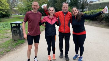 2 males and 2 females are celebrating having just finished a run