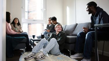 Students gathered in social spaces in Sheffield accommodation