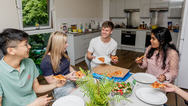 Students gathered in social spaces in University of Sheffield accommodation