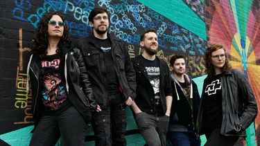Photo of a rock band called powerhouse made up of five band mates