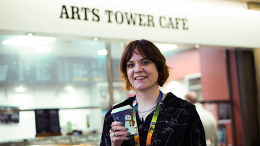 Christmas drinks cup winner holding her design