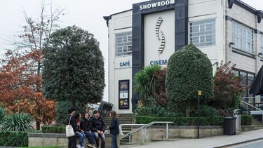 students sat outside showroom cinema
