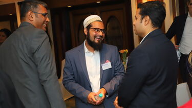 Three male Sheffield alumni at a reception in Mumbai