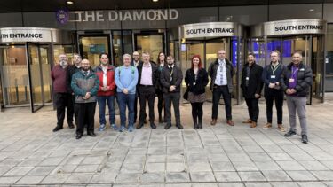 ASISST team outside The Diamond building