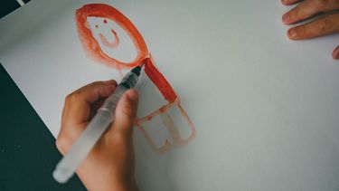 A child's drawing of a smiley face