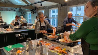 People cooking in an industrial kitchen