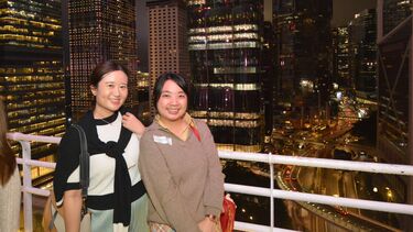 Two Sheffield alumnae smiling to the camera at the Hong Kong alumni event.