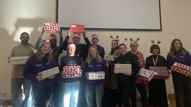 A group photo of the staff and student volunteers at the Christmas Shoebox Appeal wrapping event