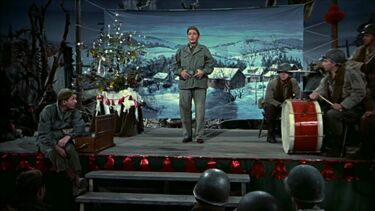 General Waverly watching a musical performance in the film White Christmas