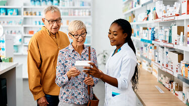 Pharmacist with older couple