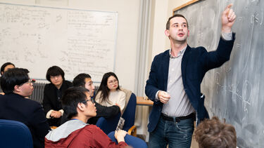 Lecturer teaching a maths class