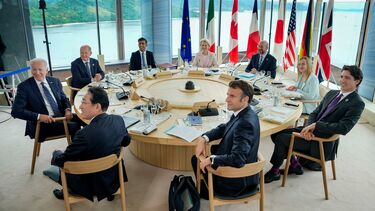 G7 leaders are sat at a table