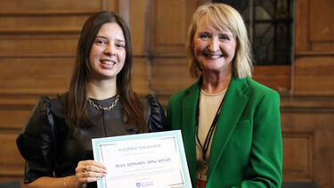 Roksolana Rohozhynska receiving her employers' award.