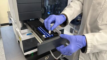 Image of scientist using MALDI-TOF Mass Spectrometer