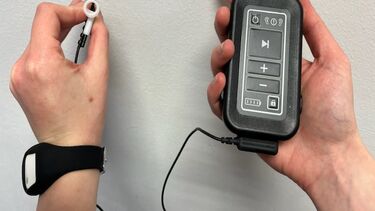 Picture of the ear piece device which is designed to help people regain arm strength after a stroke