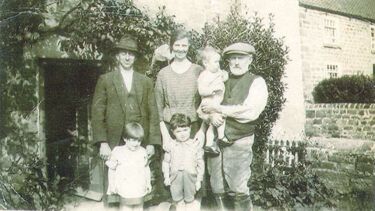 Family photo, Tom pictured centre.