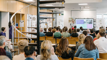 Prospective universities students watching an open day talk by an academic at the University of Sheffield
