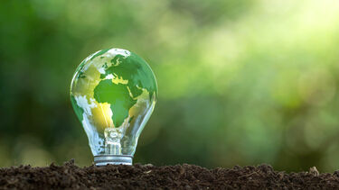 The green world map is on a light bulb that represents green energy Renewable energy that is important to the world