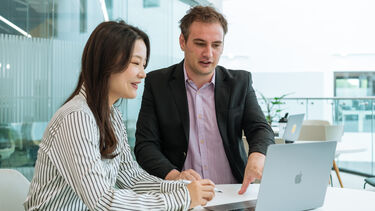 A student talking to a member of staff.
