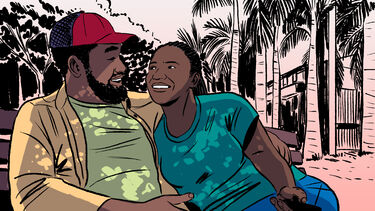A cartoon showing a man and woman sat on a bench looking happily at eachother