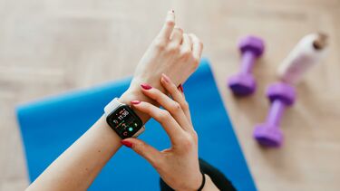 Wearable device being checked during exercise.