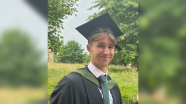 Graduate wearing mortar board 