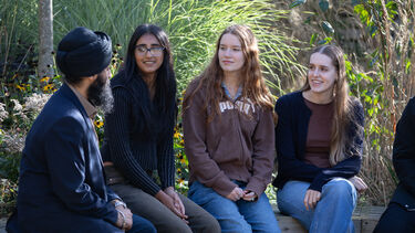 Four scholarship students on campus