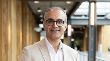 Headshot of Mehrshad Mehrpouya on a mezzanine office space