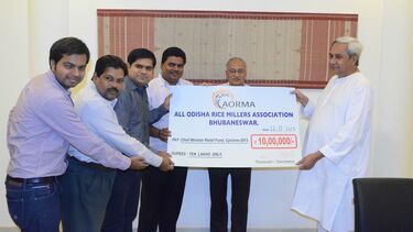 group in photo holding cheque 