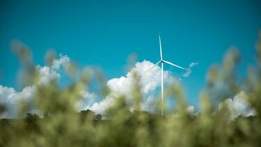 A wind turbine in a field