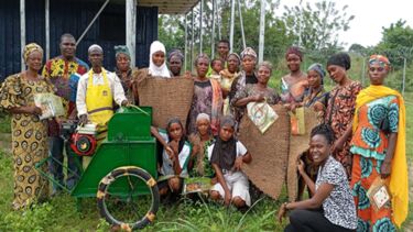 Local community members with artisan products that have been crafted from waste biomass streams using the site's infrastructure