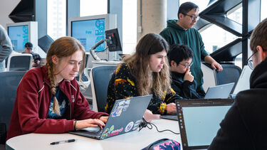 A group of students coding