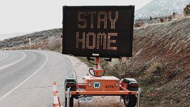 A roadside stay at home sign