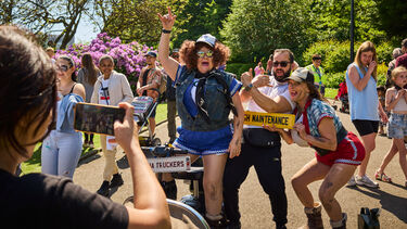Street performers with audience members in Weston Park 