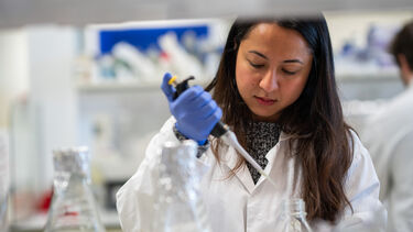 A person carrying out research in a lab.