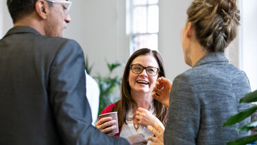 Three people networking at the Innovation Sprint event