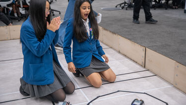 Schoolgirls in robotic lab