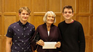 Maureen standing between two student representatives of the University of Sheffield Croquet Club