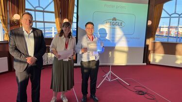 A researcher being awarded a certificate