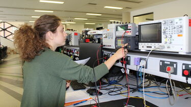 Tennessee University student working with electronics lab equipment