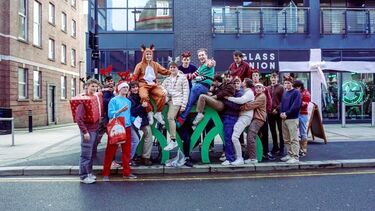 A group photo of Matt with his society, celebrating Christmas