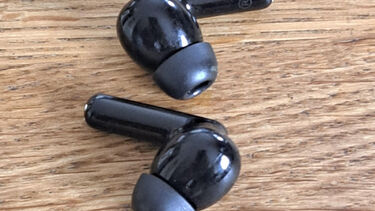 A pair of black earbuds