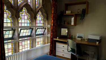 Study space and desk in a bedroom at St George's accommodation 