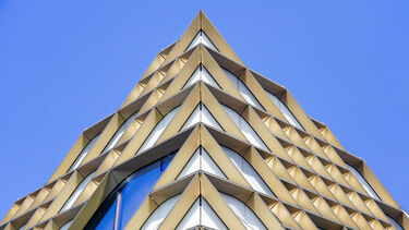 Photograph of the Diamond building against a blue sky