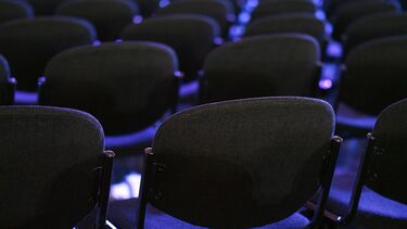 Rows of chairs lined up facing forwards