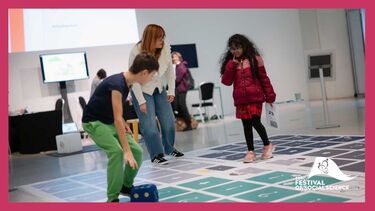 People standing on a large format board game