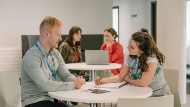 Staff meet with students in an informal setting