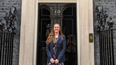 Lady standing in front of 10 downing street 