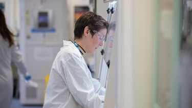 Person researching in a machine.