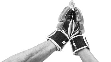 Two boxing gloves touching